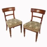 A set of eight 19th century mahogany bar back dining chairs, with stuff over seats, raised on reeded