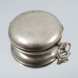 A watch case shaped box, stamped '800', 4.5cm diameter, 20g gross