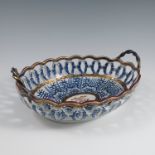 A 19th century unmarked Worcester pierced oval basket, decorated in the Royal Lily pattern, with