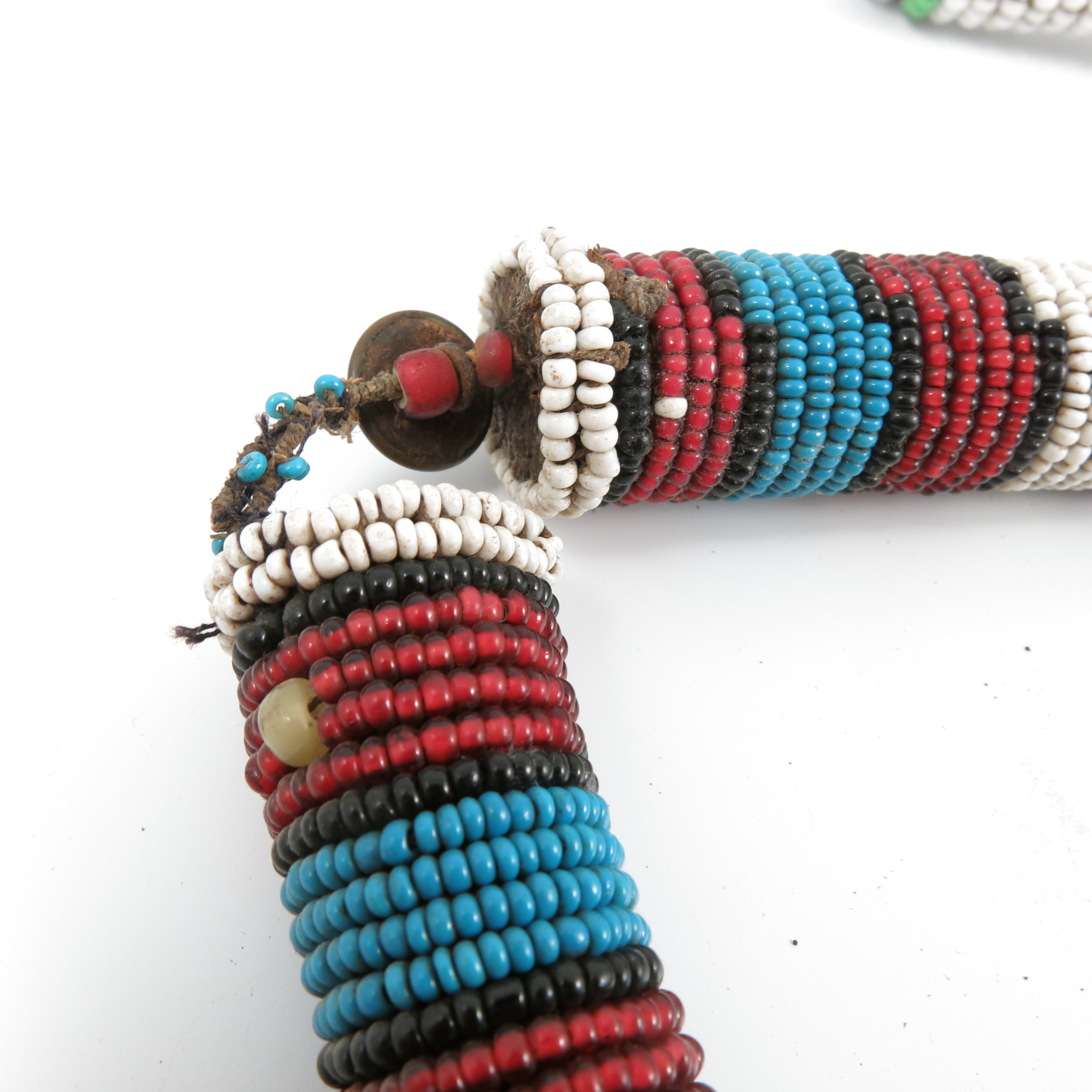 Two tribal bead work necklaces, together with a tribal bead work fly swat. - Image 3 of 3