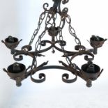 A five branch metal and wood light fitting, having glass frilled edge shades