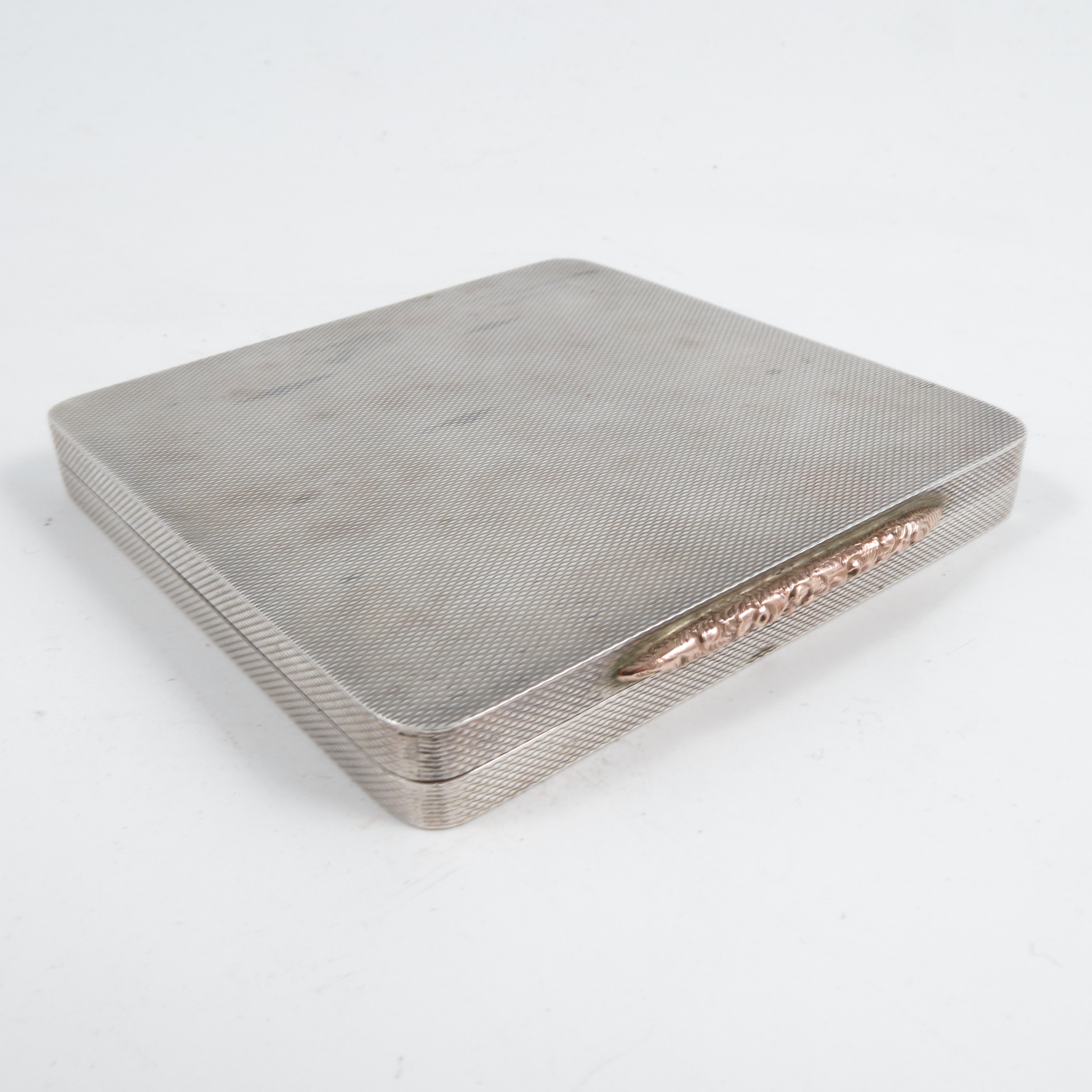 A lady's silver compact, of square form, with engine turning, gilt floral clasp, Birmingham 1947, - Image 2 of 2