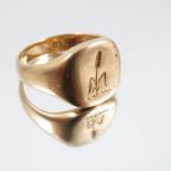 A signet ring, stamped '18ct', engraved with a crest, finger size O, 7.8g gross