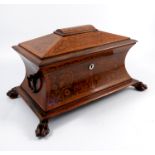 A 19th century mahogany sarcophagus shaped tea caddy, with waisted sides, having marquetry panels to