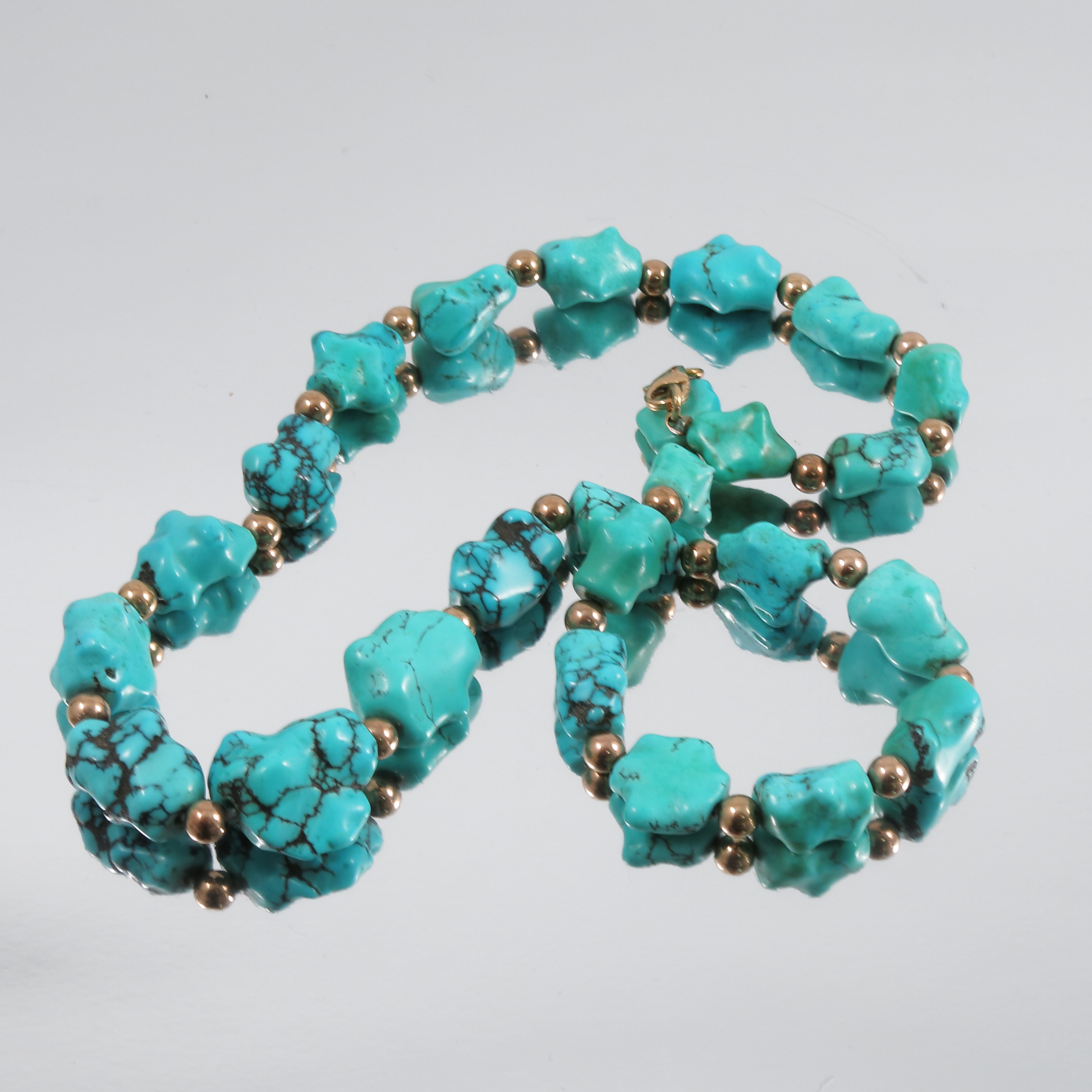 A row of tumbled turquoise, with yellow beads between, and a pair of turquoise earclips, and a - Image 2 of 2