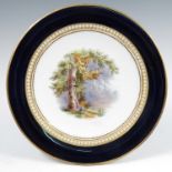A 19th century Grainger's Worcester cabinet plate, decorated with a landscape of two figures under a