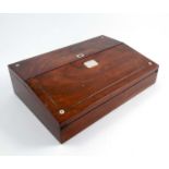 A 19th century rosewood writing slope, with mother of pearl and line inlay, the sloping front