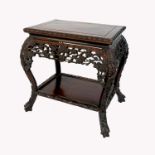 An Eastern carved hardwood stand, of rectangular form, with carved decoration, raised on curved legs