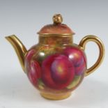 A Royal Worcester miniature tea pot, decorated all around with hand painted fruit by Harry Ayrton,
