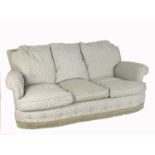 A three piece suite, with feather cushions