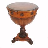 An unusual 19th century walnut circular sewing table, possibly William IV, the rising lid