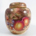 A Royal Worcester ginger jar and cover, decorated all around with fruit to a mossy background by