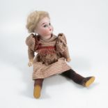 An Armand Marseille bisque headed doll, with fixed eyes, open mouth and teeth, impressed 1894 A M