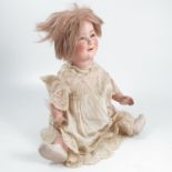 A Schoenau & Hoffmeister bisque head doll, Princess Elizabeth, marked to the back of the head