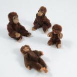 Four plush monkeys, two with pressed metal faces, one with Steiff button to its foot