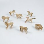 A set of eight carved Ivory Oriental horse, in various poses, height 1.75ins