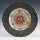 A Royal Worcester cabinet plate, the centre painted with flowers by E Barker, with gilt decoration