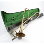 A cased brass trombone, by Antoine Courtois & Mille, engraved to the bell with exhibitions and