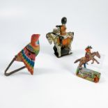 A tinplate clockwork toy, of a drummer mounted on a horse, marked Prov Pat 23710 Made in Gt Britain,