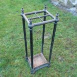 A 19th century design metal stick stand, having four divisions, height 26.5ins x width 9ins