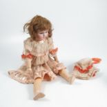 A Simon and Halbig bisque headed doll, with sleeping eyes, open mouth and teeth, impressed S&H