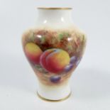 A Royal Worcester vase, of baluster form, decorated with fruit to a mossy background to the front by