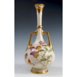 A Royal Worcester blush ivory vase, with pierced neck, gilt handles and decorated with flowers,