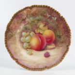 A Royal Worcester side plate, decorated with fruit to a mossy background by J Reed, with shaped gilt