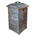 A bee hive shaped garden compost container