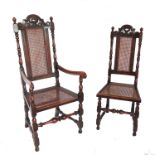 A set of six ( 4 + 2) Cromwellian style oak chairs, with carved back rail and turned and block