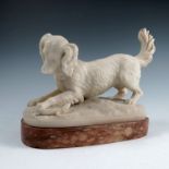 J Gott, marble sculpture of a dog playing with a lizard, on an oval mottled marble base, 11ins x