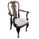 A Georgian mahogany armchair, having pierced splat, raised on cabriole legsCondition Report: No