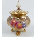 A Royal Worcester covered vase, having a pierced cover, the base decorated all a round with fruit to