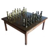 A modern brass topped oak chess table, with anodised patterned top,  fitted with two drawers and