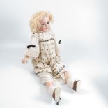 An Armand Marseille bisque headed doll, with sleeping eyes, open moth and teeth, impressed made in