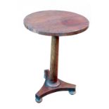 A 19th century rosewood circular occasional table, raised on a turned column, terminating in a