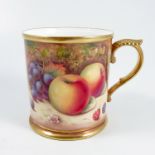 A Royal Worcester mug, decorated all around with fruit to a mossy background by P Platt, with gilt