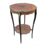 A kingwood occasional table, with heavy gilt mounts all over, raised on slender legs, with plant