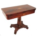 A regency rosewood card table, the fold-over top with boxwood inlaid urn decoration above a shell