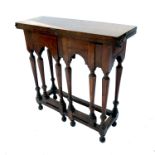 An early 18th century design rectangular fold over table, with double gate leg action, raised on