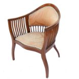 An Edwardian mahogany chair, of elongated horseshoe shaped form, with marquetry inlay and