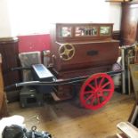 A Victorian Tomasso & Co. piano organ, playing eight tunes, together with painted push trolley,