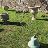 A bronze bell, height 14ins, together with a decorative metal stand with scroll frame and bell