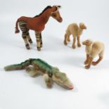 A Steiff Okapi, no labels or buttons, together with a Steiff crocodile, with label, and two