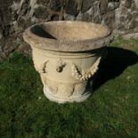 A pair of circular garden urns, decorated with classical swags and urns, diameter 24ins