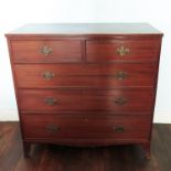 A 19th Century mahogany chest, of two short drawers over three long drawers, raised on swept