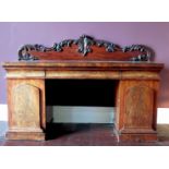 A Victorian mahogany twin pedestal sideboard, with foliate carved supastructure, fitted with a