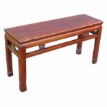 An oriental style coffee table, raised on four square feet, width 41ins, diameter 12.75ins, height