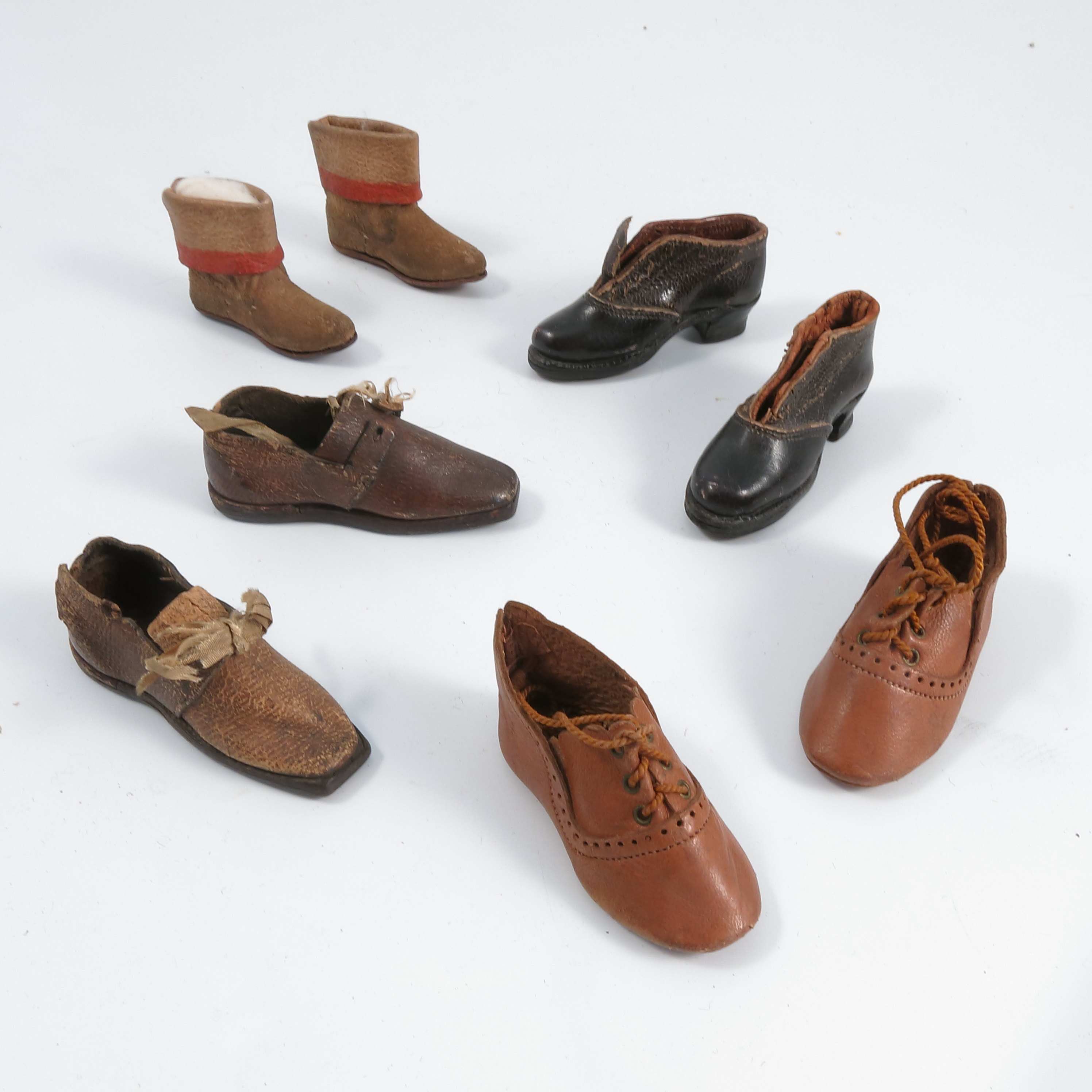 A group of dolls shoes, to include leather examples, some with wooden soles, most with leather soles