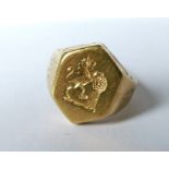 A crested signed ring, stamped '18ct', finger size M1/2, 8.2g grossCondition Report: Some wear to